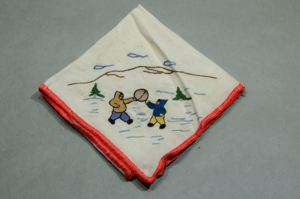 Image of Twp figures with drum, one of a set of 4 embroidered napkins, each with different outdoor activity 